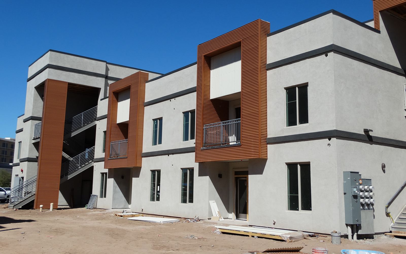 Norton Circle, a new multifamily building with a finished gray and brown exterior